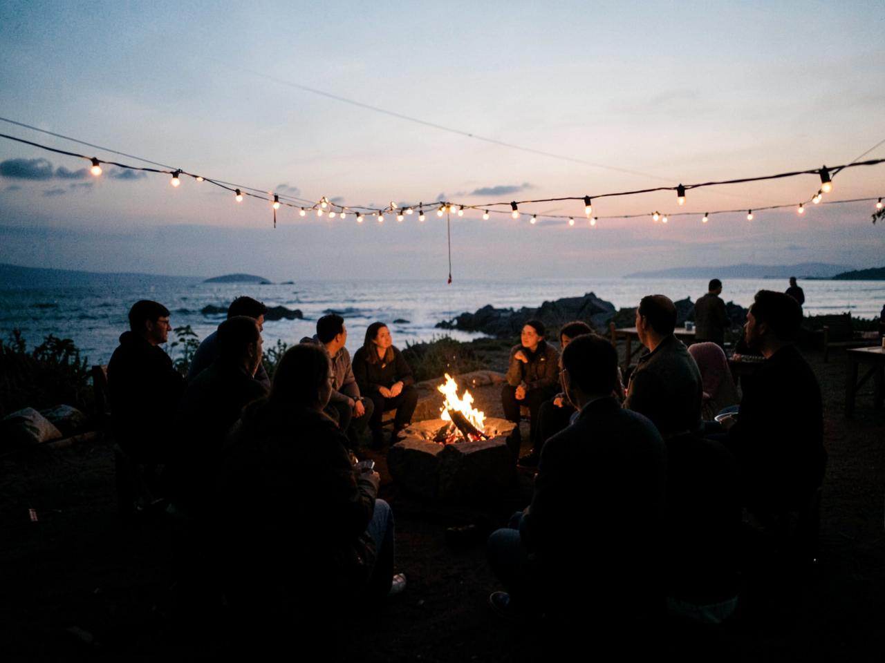 Guests gathered around tables at an outdoor celebration